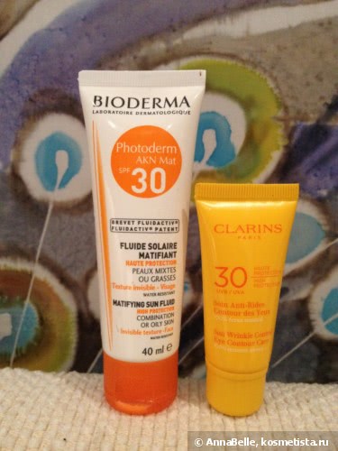 Незаменимые средства для защиты лица и кожи вокруг глаз от солнца - Bioderma Photoderm AKN Mat SPF 30 и Clarins Sunscreen for Eyes Wrinkle Control Cream SPF 30